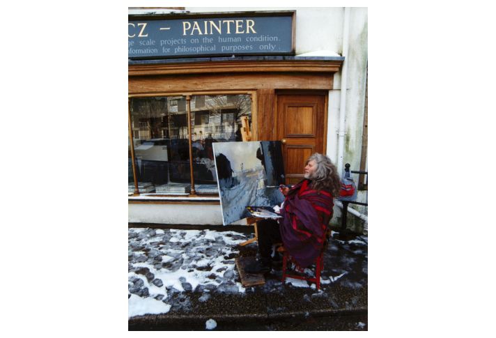 Robert painting outside his studio in the winter of 1995.
